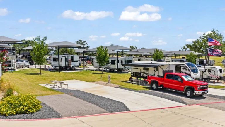 Pickup truck and fifth wheel at an RV site