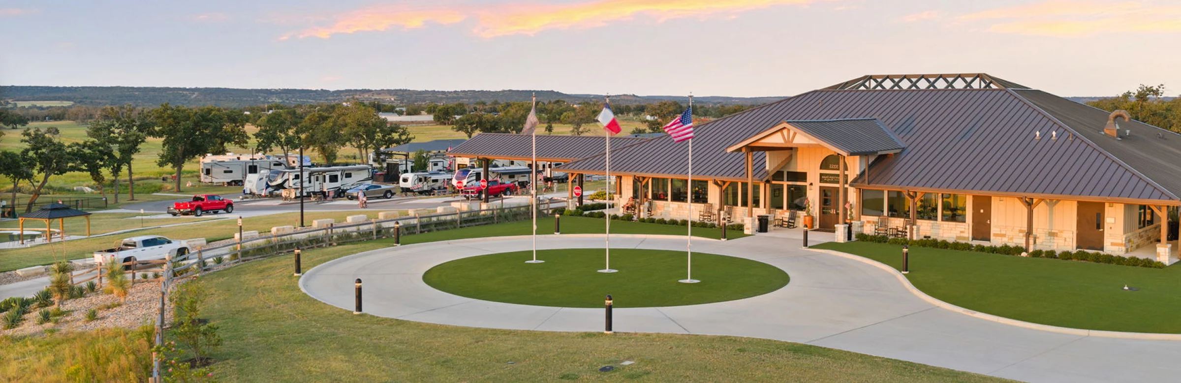 Aerial view of the Lantern Oaks clubhouse at sunset