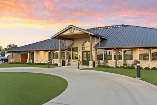 Lantern Oaks clubhouse exterior at sunset